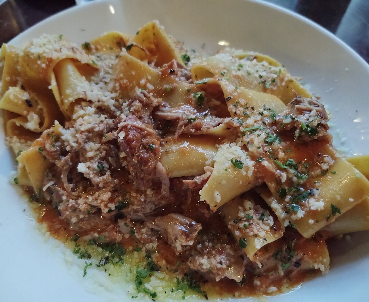 A Mano Kitchen and Bar signature dishes Bucatini CarbonaraAranciniShort Rib Pappardelle